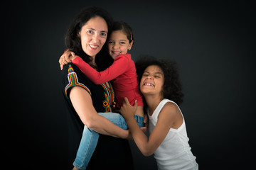 Beautiful family doing different expressions in different sets of clothes: love