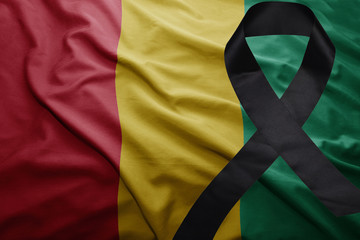flag of guinea with black mourning ribbon