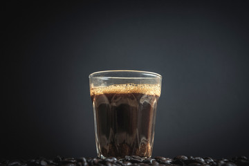 espresso in a glass on wooden table