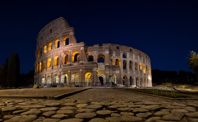 Fototapeta na wymiar Colosseum in Rome at night lit up from the inside