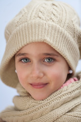 Pretty small girl with wool scarf