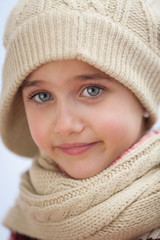 Pretty small girl with wool scarf