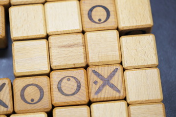 Close-Up Of Rolling Dices On Wooden Table 