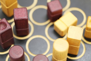 Close-Up Of Rolling Dices On Wooden Table 