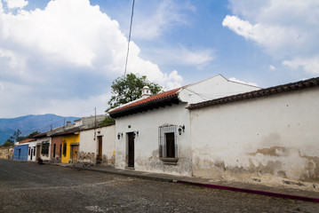 Fototapeta na wymiar Yellow and white Baroque style building in Antigua, guatemala.