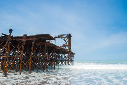 Old rusty pier in Guatemala shot in a cloudy morning. Champerico 