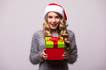 happy woman in Santa hat hold  Christmas gift