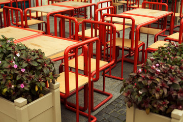 Fototapeta na wymiar Empty tables made of ecological materials in between dining hours