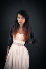 Fototapeta premium Beautiful woman doing different expressions in different sets of clothes: angry