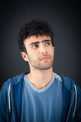 Fototapeta premium Handsome man doing different expressions in different sets of clothes: thinking