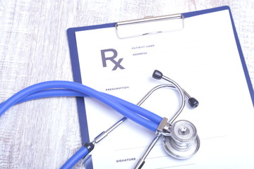 Closeup of stethoscope on a rx prescription