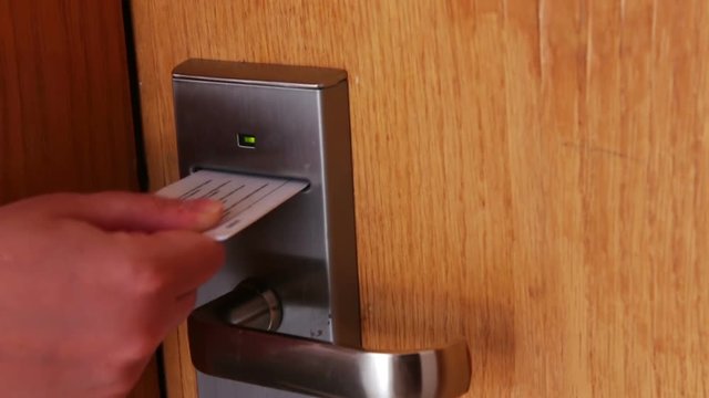 woman opens the door with the key card