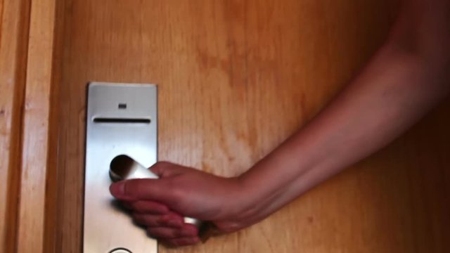 woman opens the door with the key card