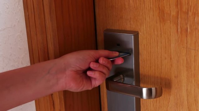 woman opens the door with the key card