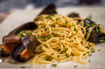 Spaghetti "alla chioggiotta" (with mussels), venetian speciality in a restaurant in Venice.

