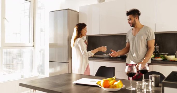 Young Mixed Race Couple Morning Sunlight, Happy Hispanic Man Asian Woman Together In Kitchen Breakfast Slow Motion