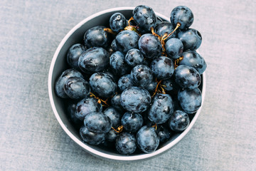 Dark grapes in plate, fresh grapes in the plate, Black Grape.