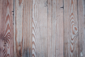 The texture of faded wood planks.