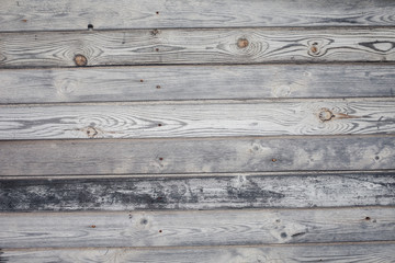 Obraz premium The texture of faded wood planks.