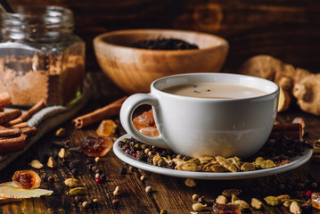 Masala Chai in White Cup with Different Spices