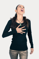 Beautiful woman doing different expressions in different sets of clothes: heart attack