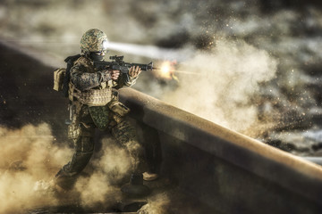 Toy that recreates a soldier covering himself with an explosion
