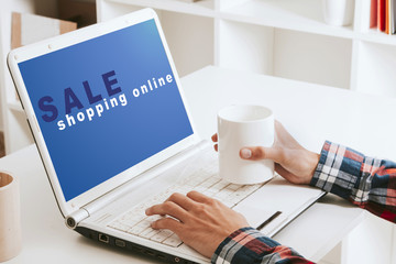 closeup of the hands in the laptop computer and the online shopping
