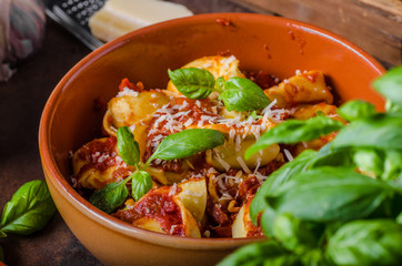 Homemade tortellini with tomato sauce