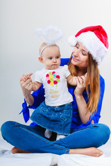 Christmas woman with cute baby.
