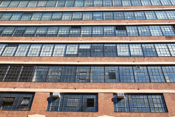 Typical building facade from the 1930th with ribbons of windows and masonry spandrels