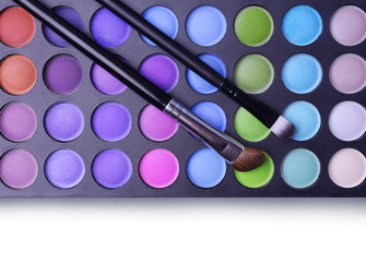 Professional palette of shadows and makeup brushes