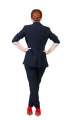 back view of redhead business woman contemplating.