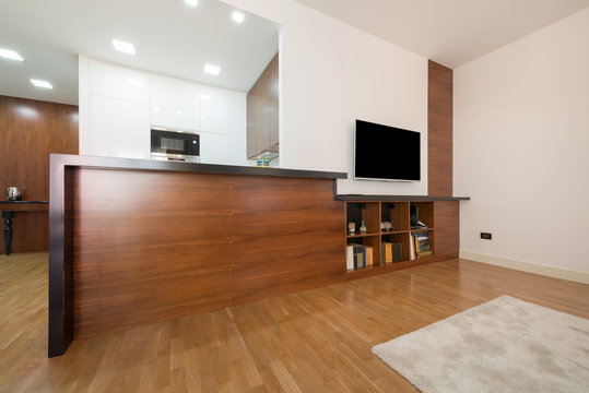 Wooden counter in modern new apartment interior, living room are