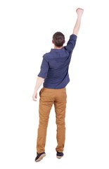 Back view of  man in checkered shirt Raised his fist up in victory sign.   Rear view people collection.  backside view of person.  Isolated over white background.