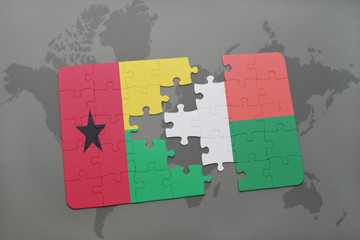 puzzle with the national flag of guinea bissau and madagascar on a world map