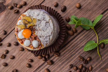 Cake with cream on a dark wood background. Top view. Close-up