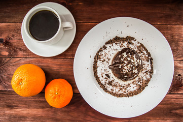 Cupcakes with coffee beans and a cup of  on the table. Top view. Close-up
