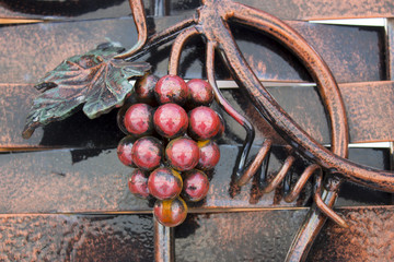 Forging railing with vine branches. Architectural detail.