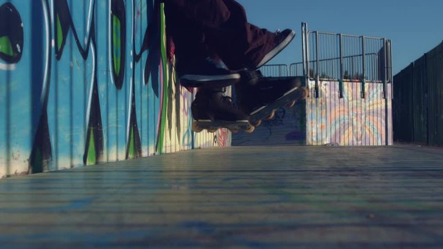 4k Colourful Shot of Legs of Young people having fun in Skatepark