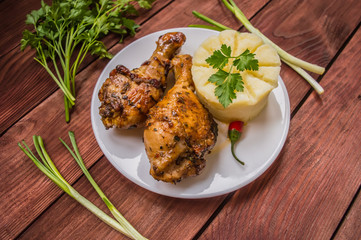 Fried chicken legs. Wooden rustic background. Top view. Close-up