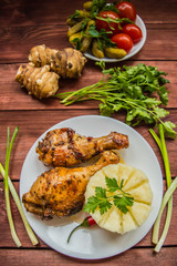 Fried chicken legs. Wooden rustic background. Top view. Close-up