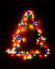 Christmas tree shape of multicolor garland lights