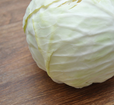 head cabbage isolated on wooden background