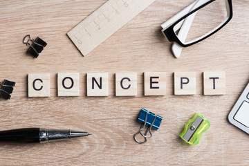 Elements of game with letters spelling business keywords on workplace