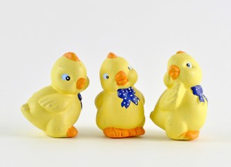 group of ceramic Easter chicks on light background 