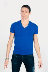 Obraz premium Handsome man doing different expressions in different sets of clothes: blink