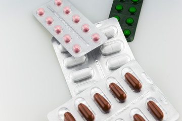 Blister Pack of colored Pills isolated on white background. 