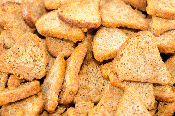 fried bread croutons close up as background