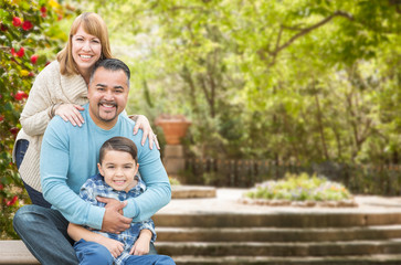 Fototapeta premium Happy Mixed Race Hispanic and Caucasian Family Portrait at the Park.