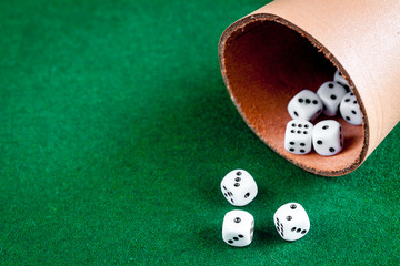 playing poker dice on green background